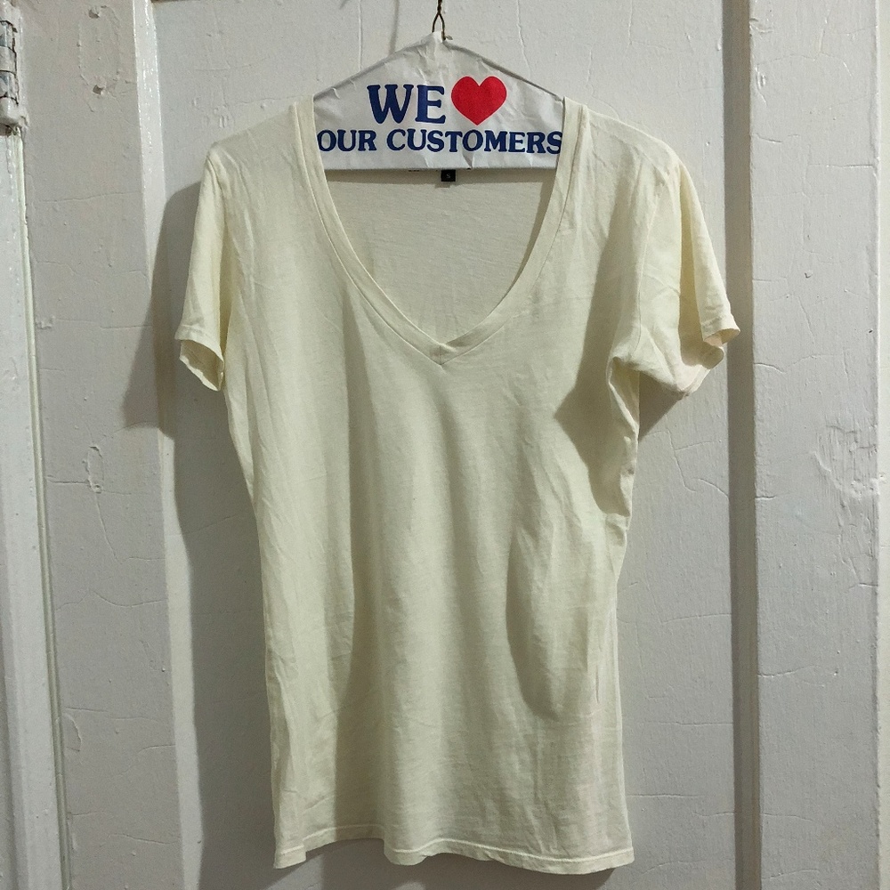 Small cream colored v-neck t-shirt